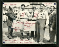 Tommy Bowler gives Andy Pafko a watch and matching luggage set, with 40,000 Murphy, Sam Kostelny, and probably Jaroslav Pelikan, pastor of Trinity Slovak Lutheran Church, on Andy Park Day at Wrigley Field, 9/23/1945. Bowler was my wife's great uncle