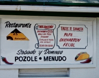 Painted sign for Mexican restaurant with name erased