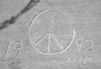 Incomplete peace symbol, 1992. Chicago lakefront stone paintings, between Belmont and Diversey Harbors. 2002