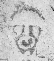Simian face. Lost. Chicago lakefront stone paintings, between Belmont and Diversey Harbors. 2002
