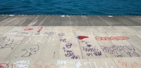 Fresh graffiti. Chicago lakefront stone writing, between Belmont and Diversey Harbors. 2022