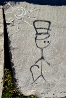 Stick figure and sun. Chicago lakefront stone drawings, between Belmont and Diversey Harbors. 2015