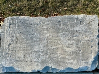Autograph rock: Al, DIck, C, CL, Bob, others. Chicago lakefront stone carvings, between Belmont and Diversey Harbors. 2024