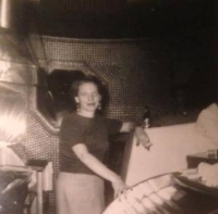 Huntington, West Virginia’s Bottle Cap Inn owner Tress Howard and a wall of bottle caps, posted on Facebook by Kathy Elliott Conrad