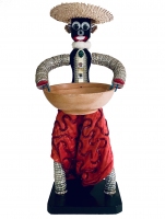 Black bottle-cap figure with dress, vest, neck ruffle, fancy earring and straw hat - vernacular art