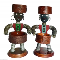 Pair of bottle-cap figures with  carved nose and mouth, felt vests and rustic wood bowls - vernacular art