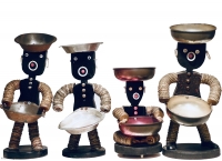 Quartet of black bottle-cap figures with head and body made from one piece of wood - vernacular art