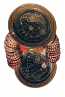 Top view of brown bottle-cap figure with Texas-themed trays standing on a music box - vernacular art