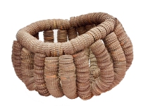 Gently curving brown bottle cap-basket - vernacular art