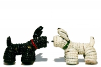 A black and a white bottle-cap dogs - vernacular art