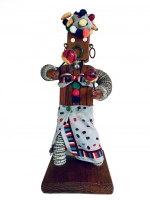 Brown bottle-cap figure with incised body, maracas, skirt and fruity headdress  - vernacular art