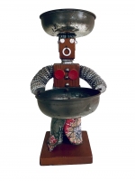 Brown bottle-cap figure with dress and breasts- vernacular art
