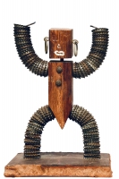 Brown bottle-cap figure with no bowls, primitive face and pointed crotch  - vernacular art