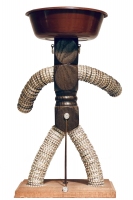Brown bottle-cap figure with three-part thorax and wire supports, rear view - vernacular art