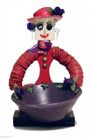 Red bottle-cap figure with hat and fancy decorations- vernacular art