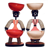 Pair of  pink bottle cap figures with tapered bodies  - vernacular art