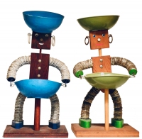 Two bottle-cap figures with feet and post supporting bowl - vernacular art