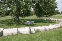 Stone circle with heavily carved rock. Chicago lakefront stone carvings, at 44th Street, south of Oakwood Beach. 2021