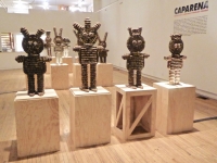 Caparena, Clarence and Grace Woolsey bottle-cap figures at Intuit, installation view