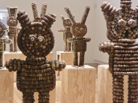 Caparena, Clarence and Grace Woolsey bottle-cap figure at Intuit, installation detail