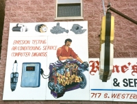This highly detailed sign is one of a pair that looks to be by the same artist, but advertising shops four miles apart on South Western Avenue. This one, Rene's Auto Parts, is between Flournoy and Lexington (700 south). The sign is long gone