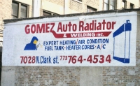 Sign for Gomez Auto Radiator & Welding. The sign was at Ridge Avenue and Clark Street