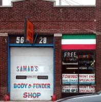 Over a period of years Samad Ahmadi ran his own festival of art on Broadway north of Bryn Mawr Avenue in Chicago, including this body shop. The hand lettering was among his more modest efforts