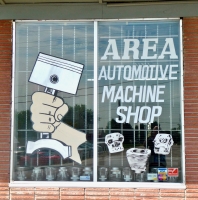 Hand grips piston in window sign for Area Automotive Machine Shop, Federal Blvd., Denver, Colorado-Roadside Art