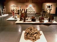 A view of Intuit's Crowning Achievements show, held at InsideArt in Chicago. Other than an anonymous chain, the pieces in the foreground are by Clarence and Grace Woolsey. Against the back wall are works by Mr. Imagination and Rick Ladd