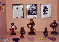 Several of the most unusual figures share the alcove of honor with a group of grape-shaped trivets and Popular Hobbies articles