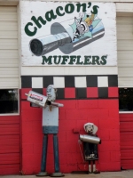 Elaborate muffler men at Chacon's Mufflers, Federal Blvd., Denver, Colorado
