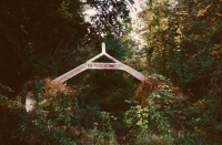 Beyond this archway along a short but overgrown path was an intact statue of the Virgin Mary. E.T. Wickham site, 1995.