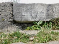 EV, vertical. Chicago lakefront stone carvings, between Foster Avenue and Montrose. 2022