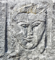Formerly gold-capped face. Now looks like Elvis. Chicago lakefront stone carvings, between Foster Avenue and Bryn Mawr. 2017