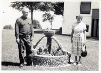 Couple with a stone-encrusted planter, snapshot
