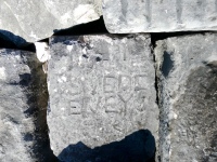 Swede Evey. Lakefront stone carvings, Veterans Memorial Park (former site of the Stateline power plant), Hammond, Indiana. 2024
