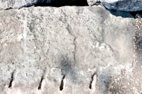 Possibly a profile and a fish or banner. Chicago lakefront stone carvings, 57th Street Beach. 2021