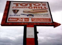 Toto's Express sign with gyros and sandwich