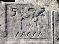 52 with symbols and squiggel from 12-panel carving. Chicago Lakefront stone carvings, south of La Rabida Hospital. 2025