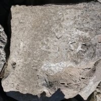 Bob, arrow, KR, others. Chicago Lakefront stone carvings, south of La Rabida Hospital. 2025