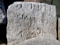 Jake, Fuck, Jim, V, deep cut shapes, C. Fogle. Chicago Lakefront stone carvings, south of La Rabida Hospital. 2025