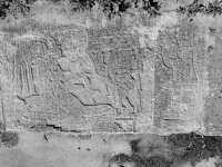 Mesoamerican scene with reclining and standing figures and a small pyramid. Chicago lakefront stone carvings between Foster Avenue and Bryn Mawr. 2013