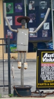 Lawrence Auto Works, Lawrence Avenue at Kenneth. Nice hat on the muffler man