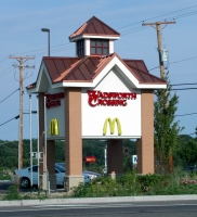 A monumental sign for a strip mall. Another sign that\'s not an actual mansard but in the same spirit. Wadsworth, Illinois, 2003