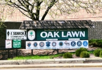 All those signs need a mansard roof to bring them together. That mansard roof was in need of some repair. Oak Lawn, Illinois, 2004