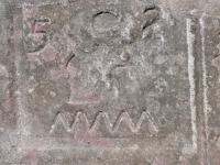 52 with symbols and squiggel from 12-panel carving. Chicago Lakefront stone carvings, south of La Rabida Hospital. 2022