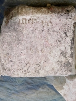 Melvin and undeciphered. Chicago Lakefront stone carvings, south of La Rabida Hospital. 2024