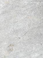 A M in a heart, MV, detail. Chicago lakefront stone carvings, near Montrose Beach. 2023