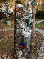 Junk enclosure, with tower of metal junk in the background, Howard Finster's Paradise Garden, 2016
