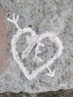 Arrow through heart with YE. Chicago lakefront stone carvings, Promontory Point. 2025